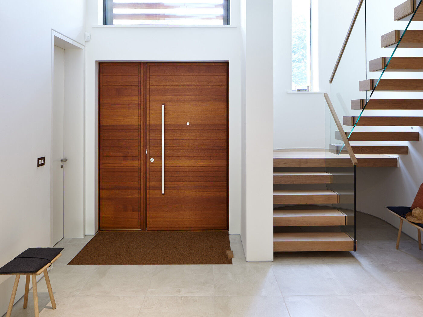 The contemporary front door is matched by the modern interior
