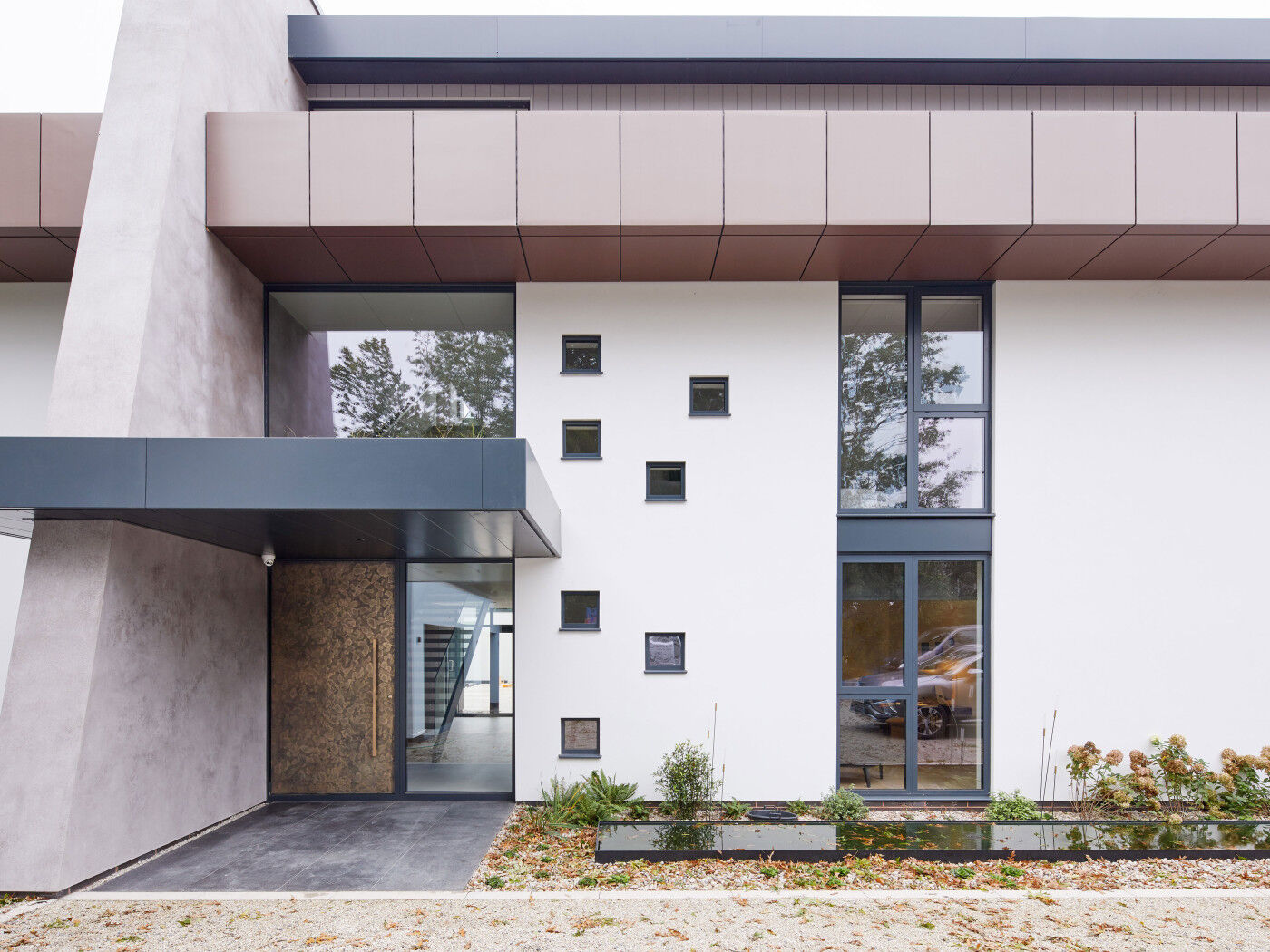 Bronze door exterior facade | Urban Front