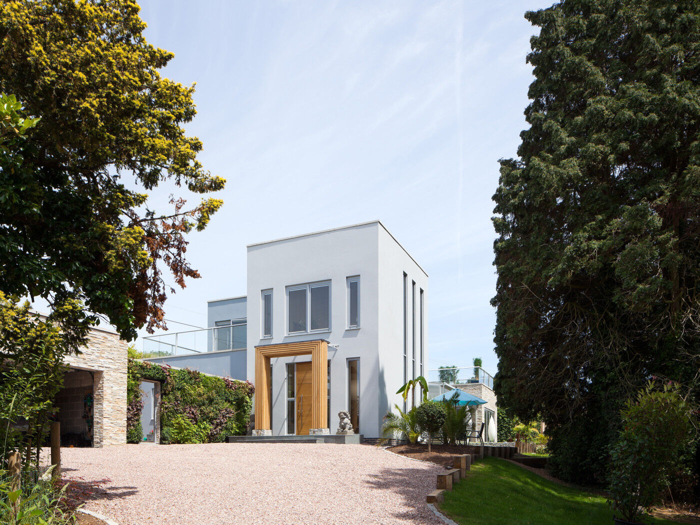 The matching overhead boarded panel creates the illusion of an oversized door