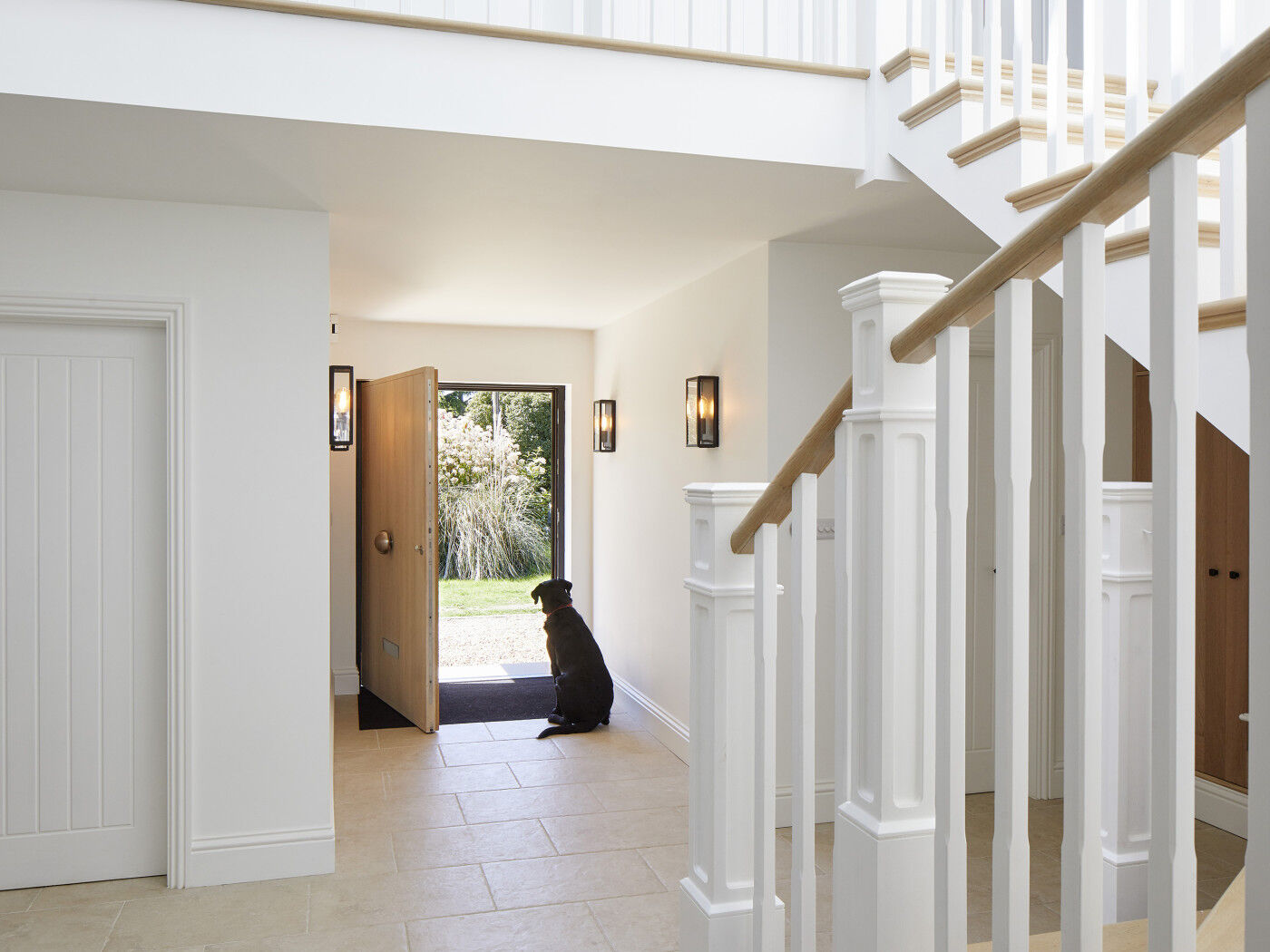 This pup is a good reference for just how big this oversized front door is