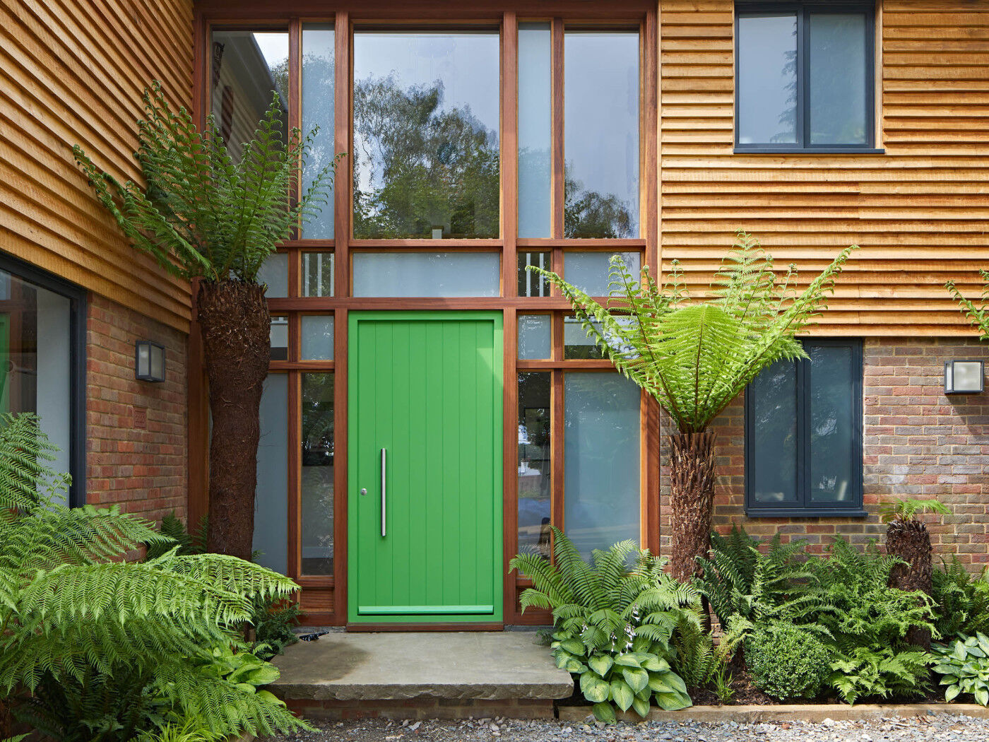 Adding extra interest around the entrance is this glazed curtain walling