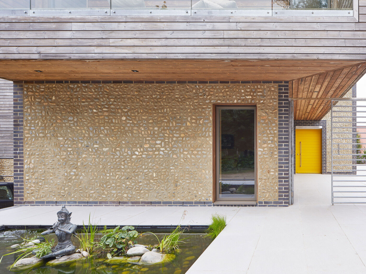 Bold yellow painted door on a contemporary house 