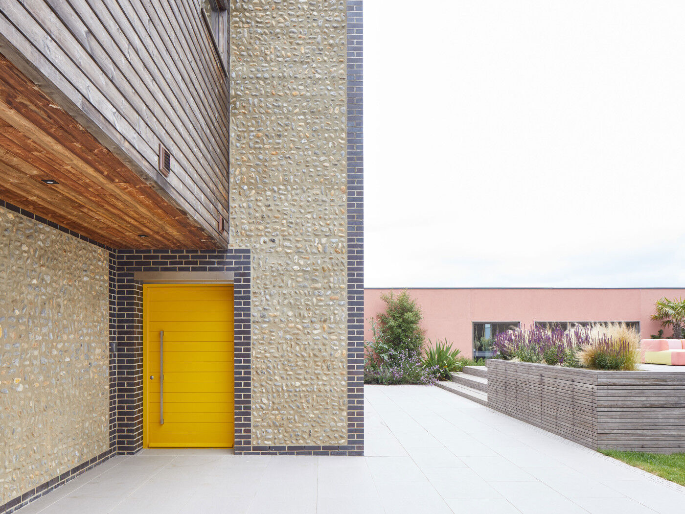 This yellow painted door stands out against the stone facade