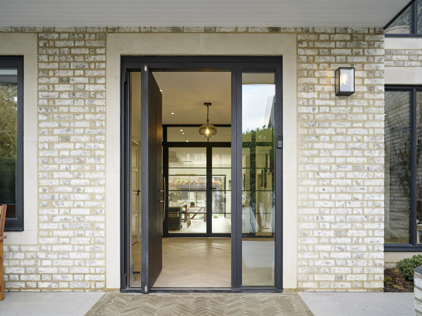 The bright open plan downstairs space is immediately apparent through the open door