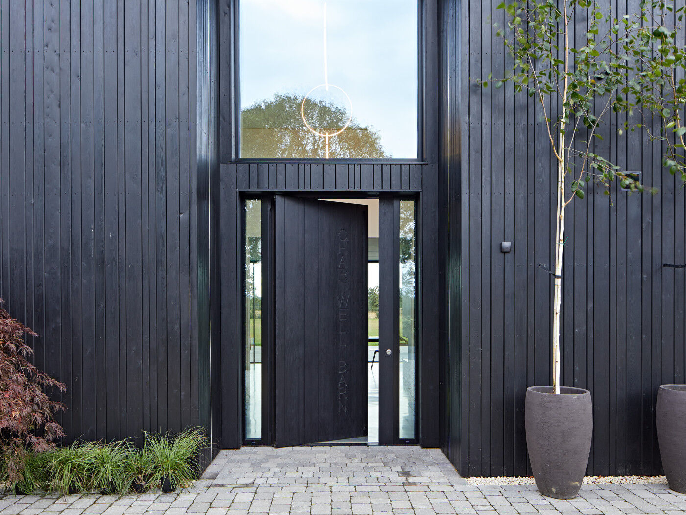 The pivot opening adds to the contemporary style of the building