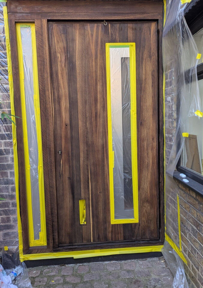 Fumed oak door being treated