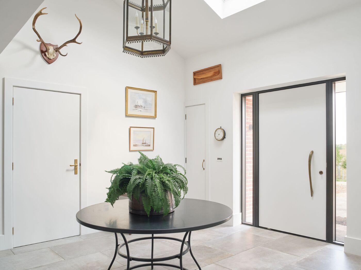 A barn conversion with a monochrome entrance design.