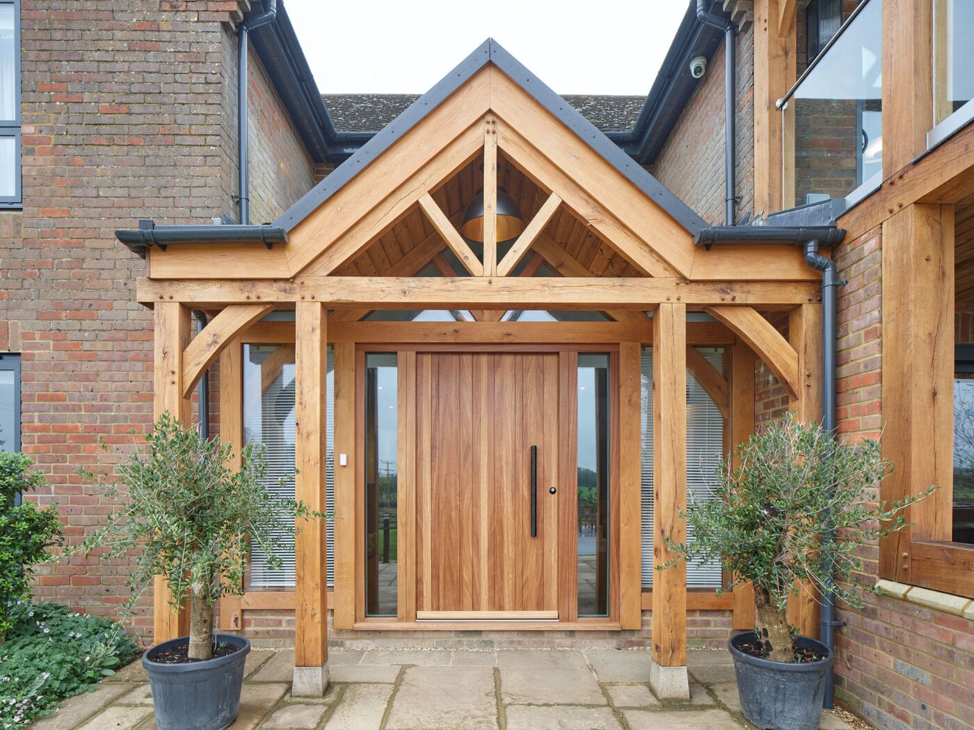 The oak frame and iroko front door help modernise a country home.