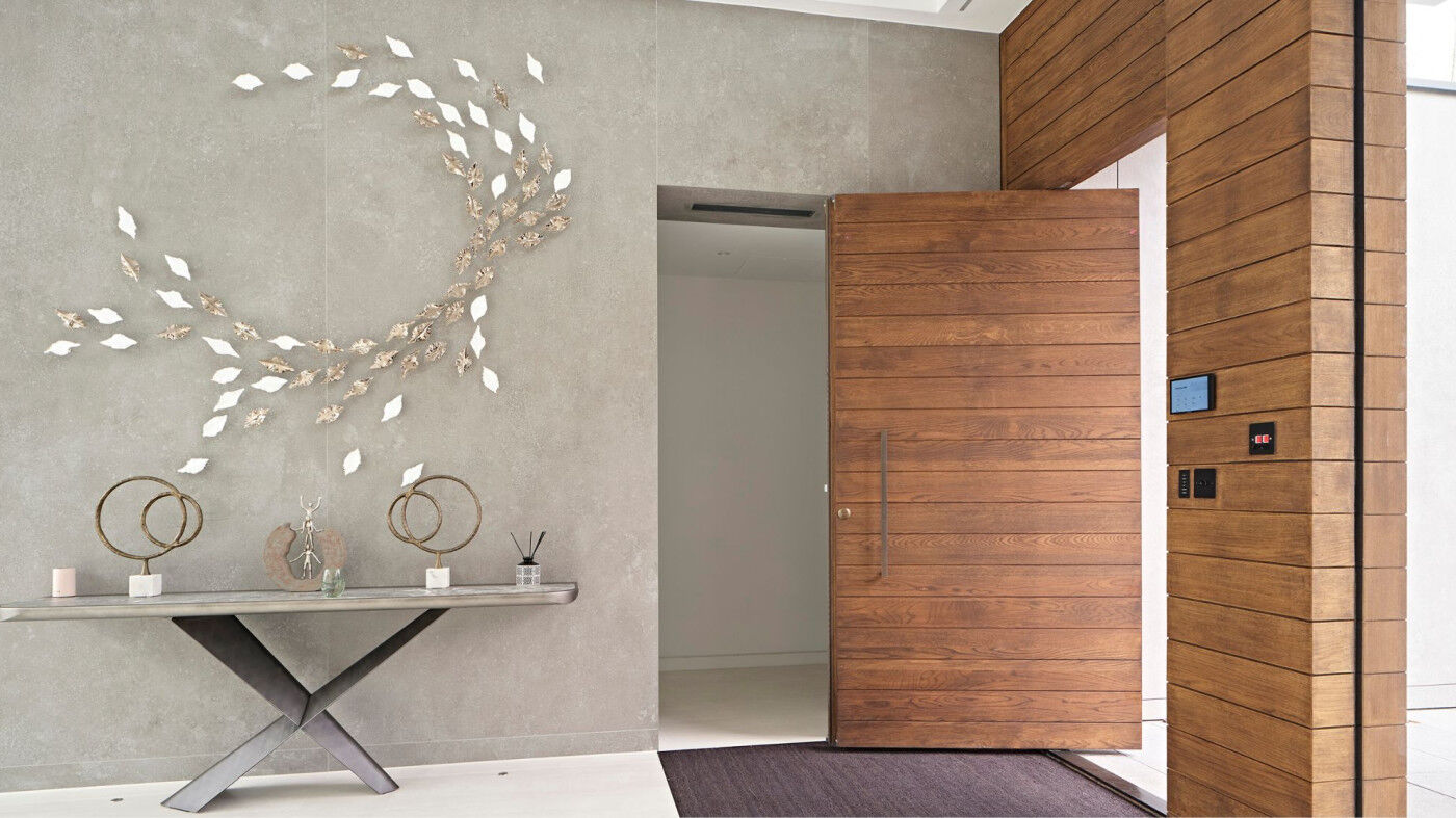 Parma pivot door in oak. Oiled onsite by customer to match cladding