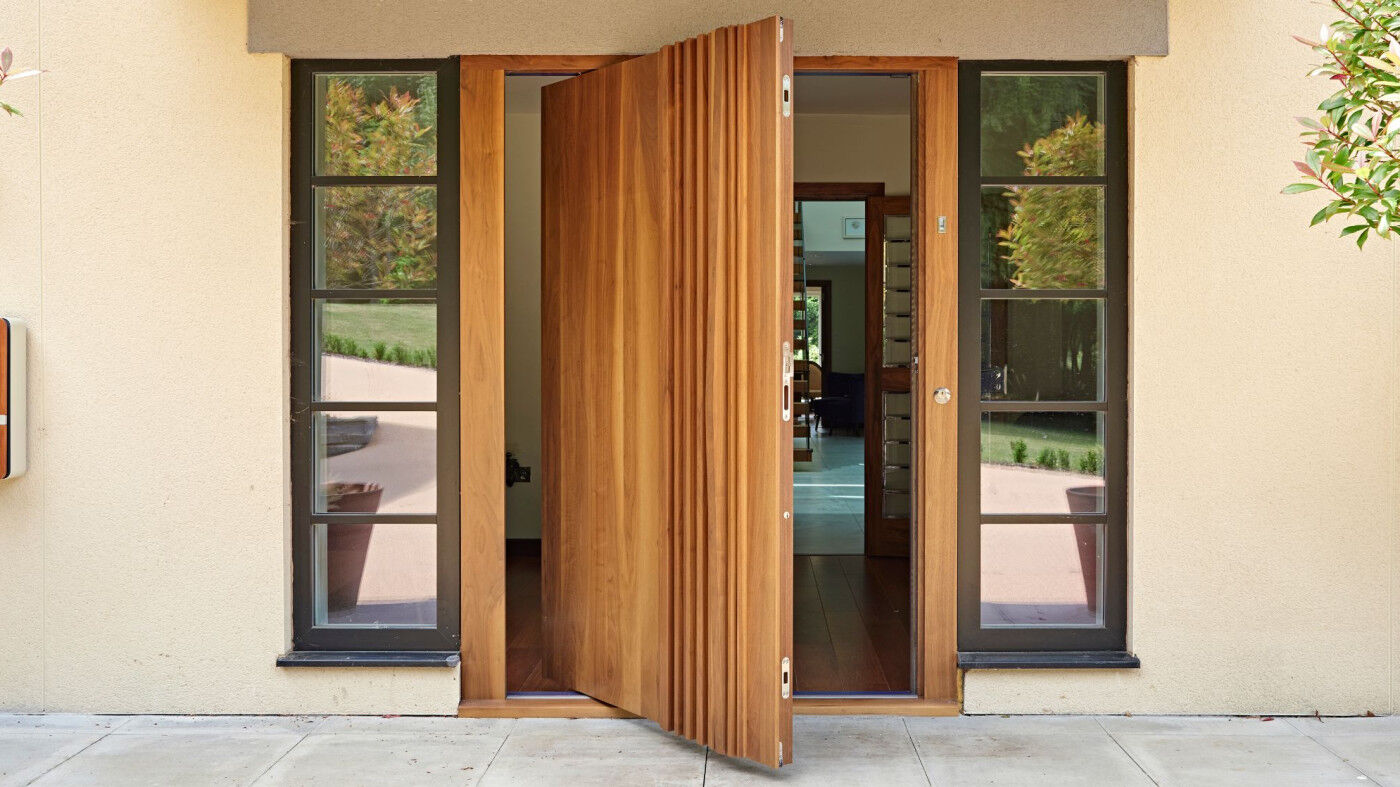 Bari pivot door in American Black walnut