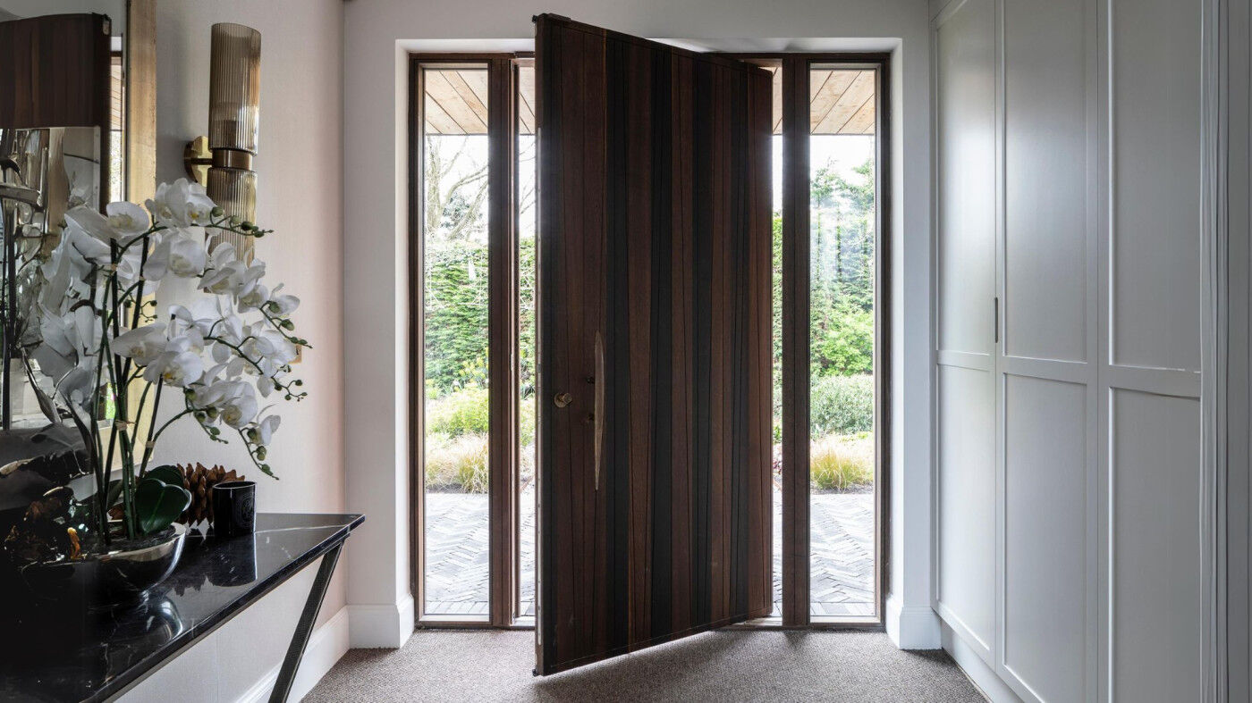 Fumed oak pivot door with BZ3 bronze handle