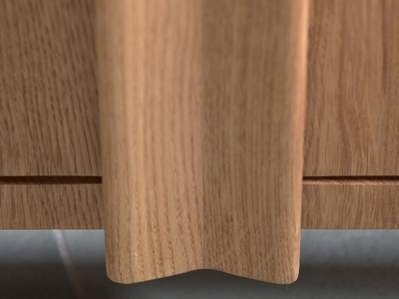 The curved handle in a bow shape is the length of the door