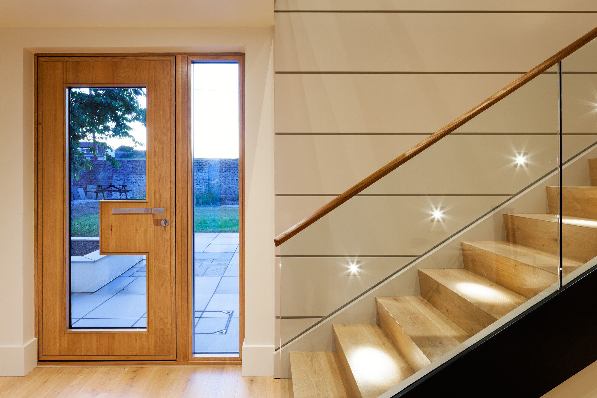 "Ice" glazed front door in oak, with sidelight in clear glass