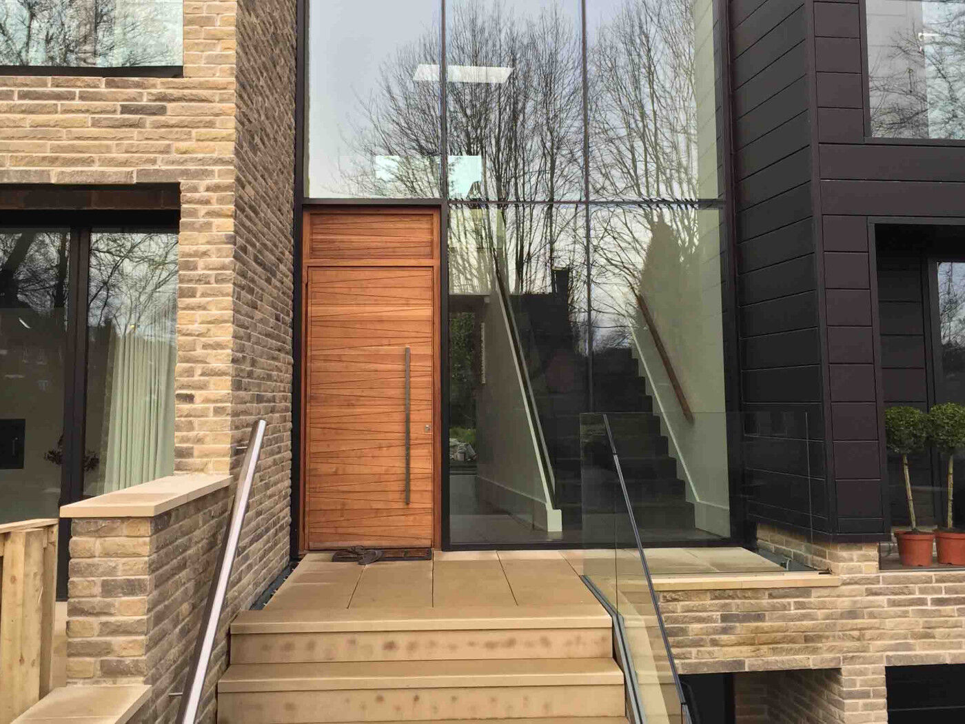 Iroko wood | Matching over panel | Milano front door