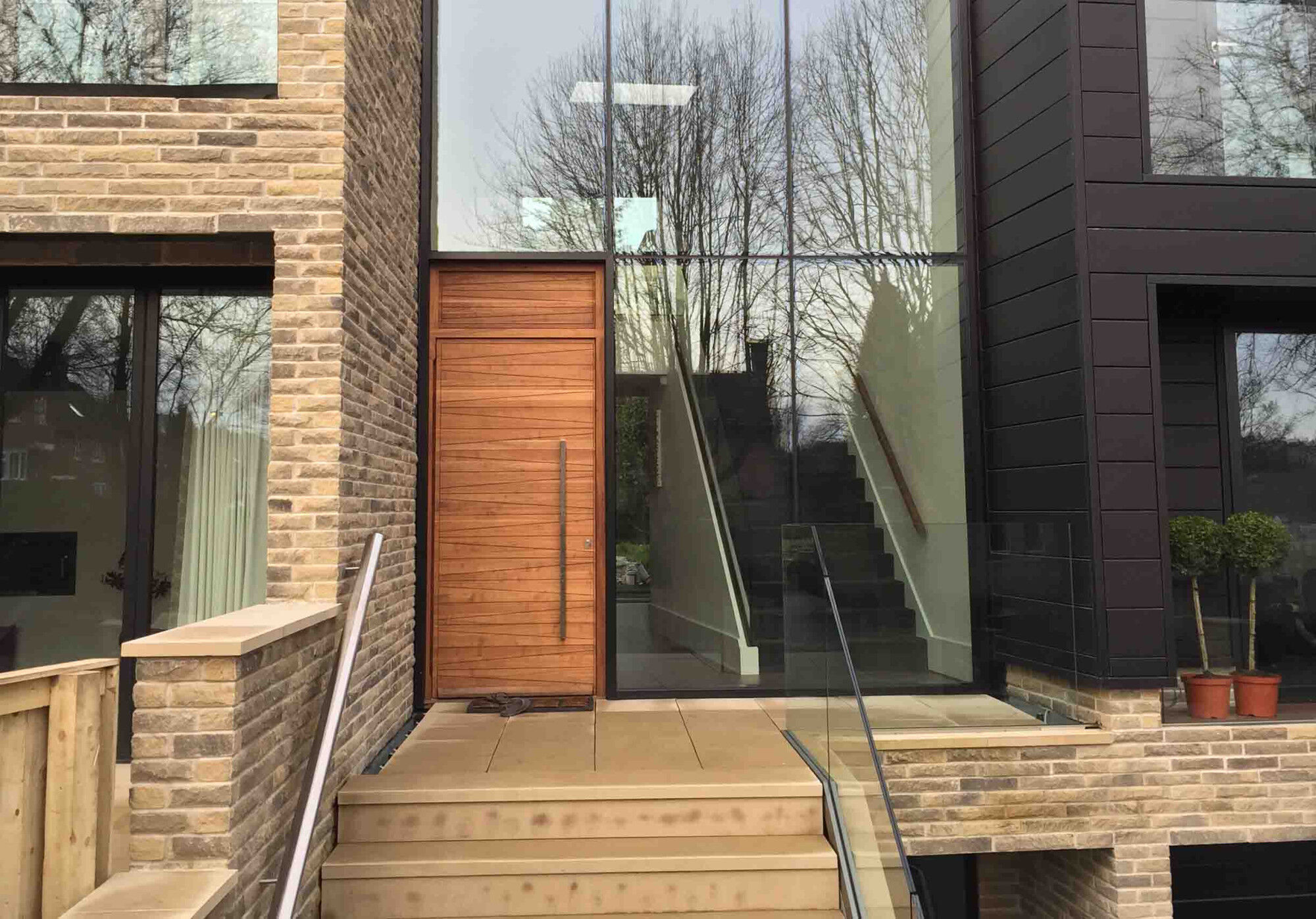 Iroko wood | Matching over panel | Milano front door