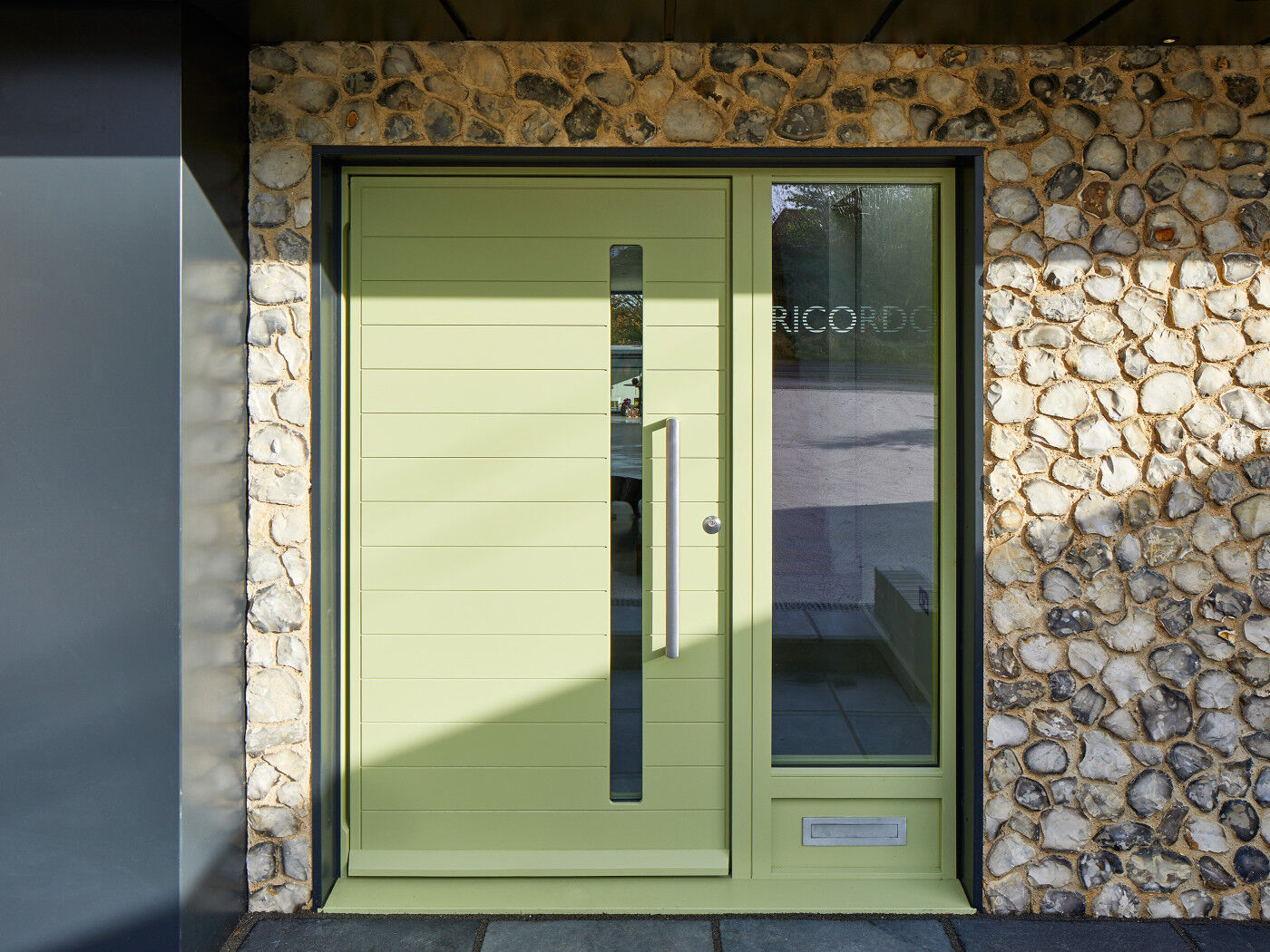 The Terano features a glass vision panel in the design and this client chose to complement this further with the addition of an etched sidelight