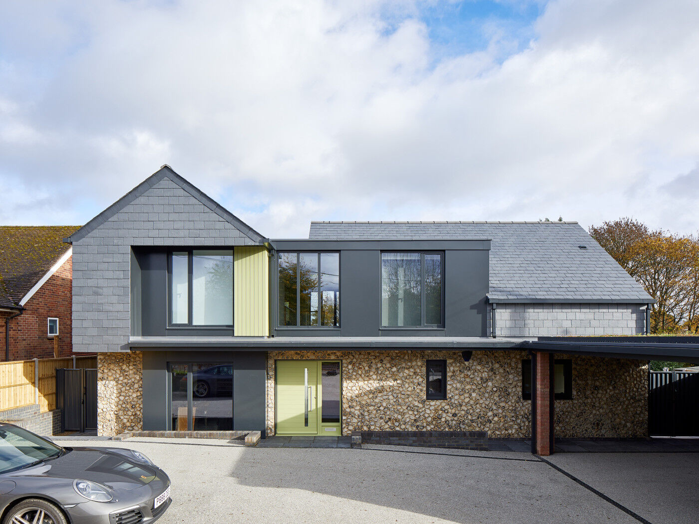 Our Terano green door draws the eye on this mixed material frontage while the artfully placed matching cladding on the second floor literally takes the whole thing to a new level 