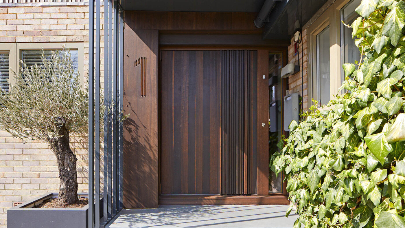 Bari door design in fumed oak, integrated wooden handle and number etching