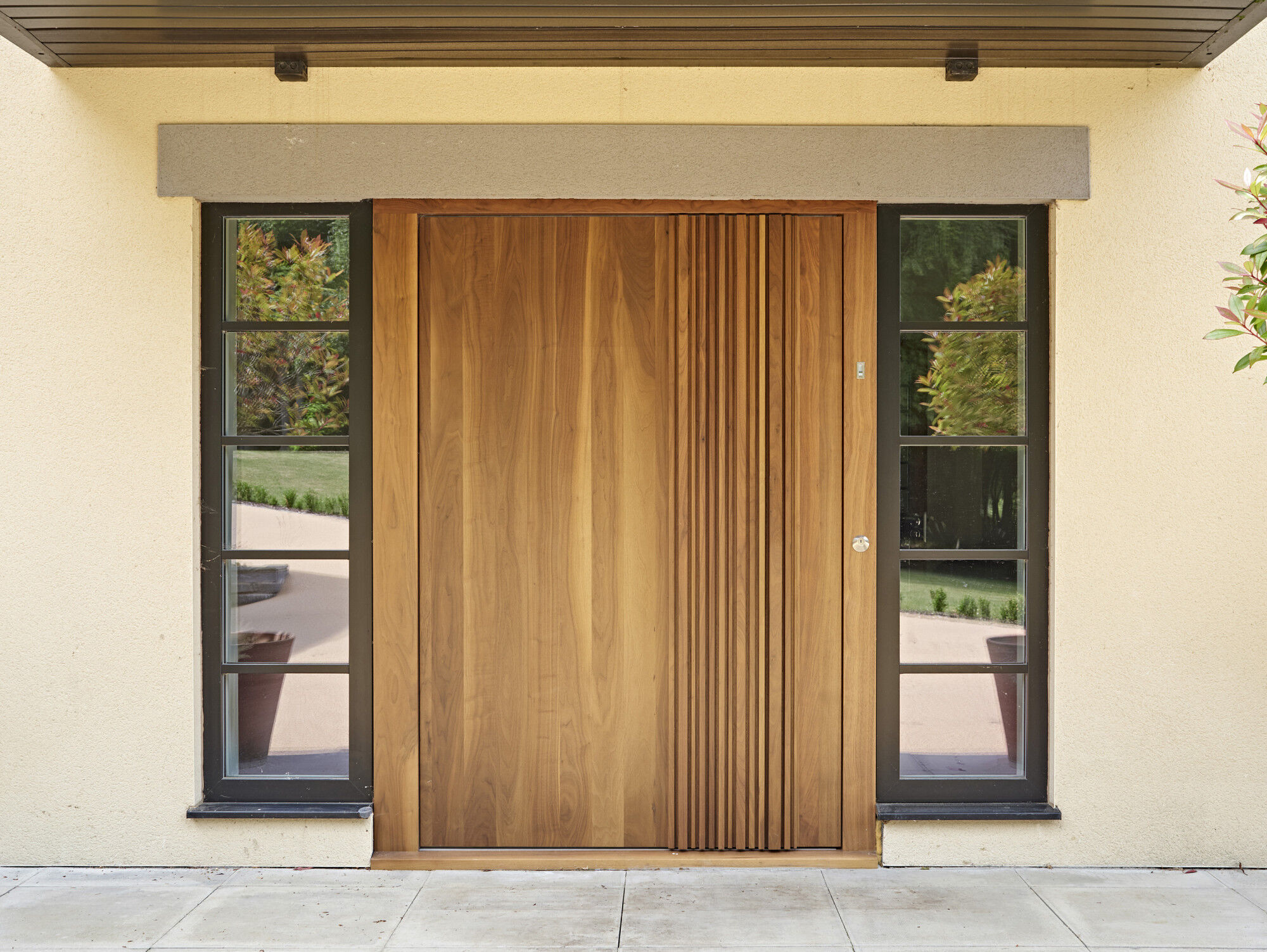 Bari Pivot door design in Walnut with Bari Handle